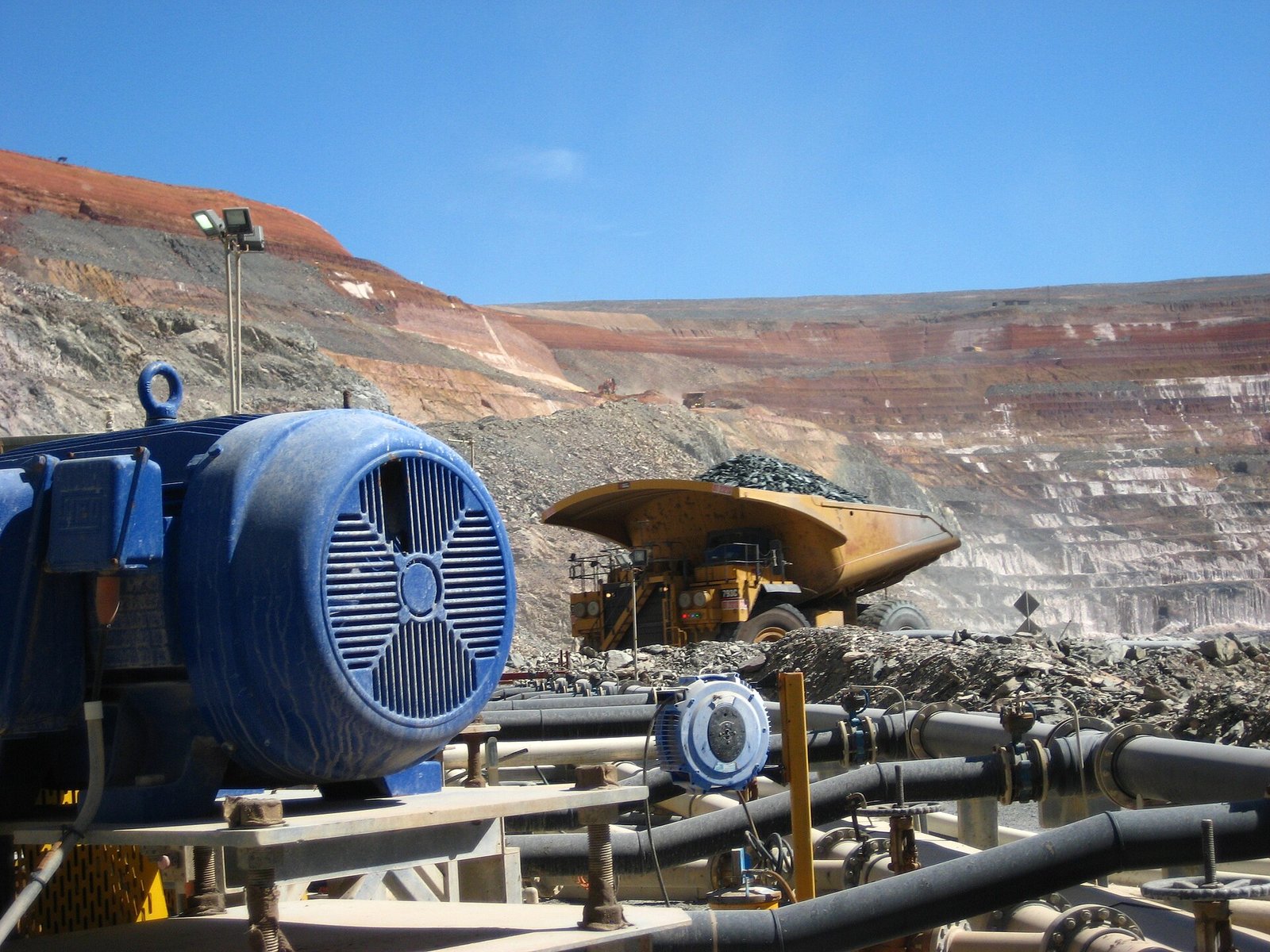 Excavator working an open-pit bench